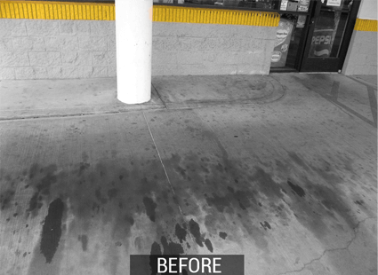 Oil and fuel stained concrete at gas station